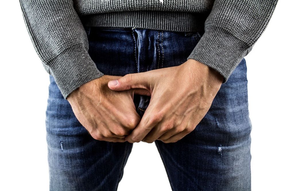 large_man_holding_pants.jpg